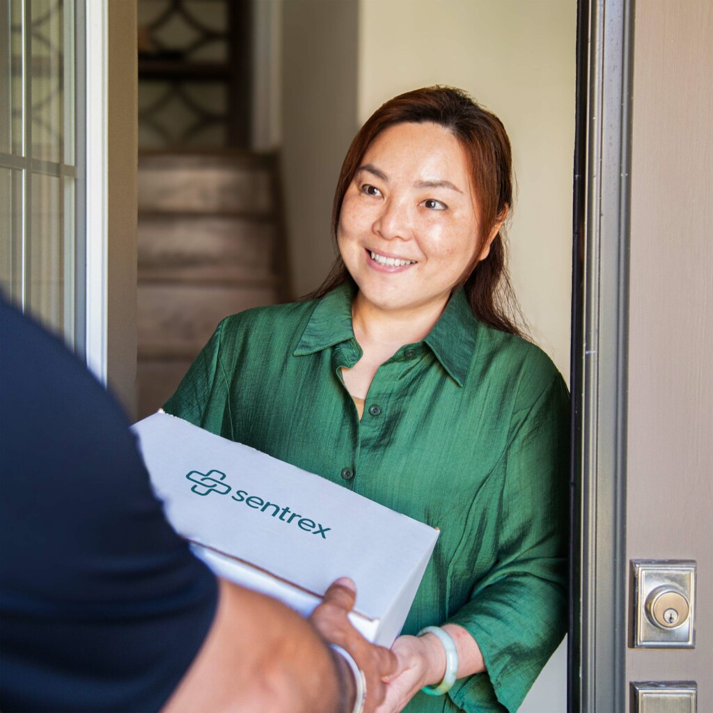 Person receiving a healthcare package at home