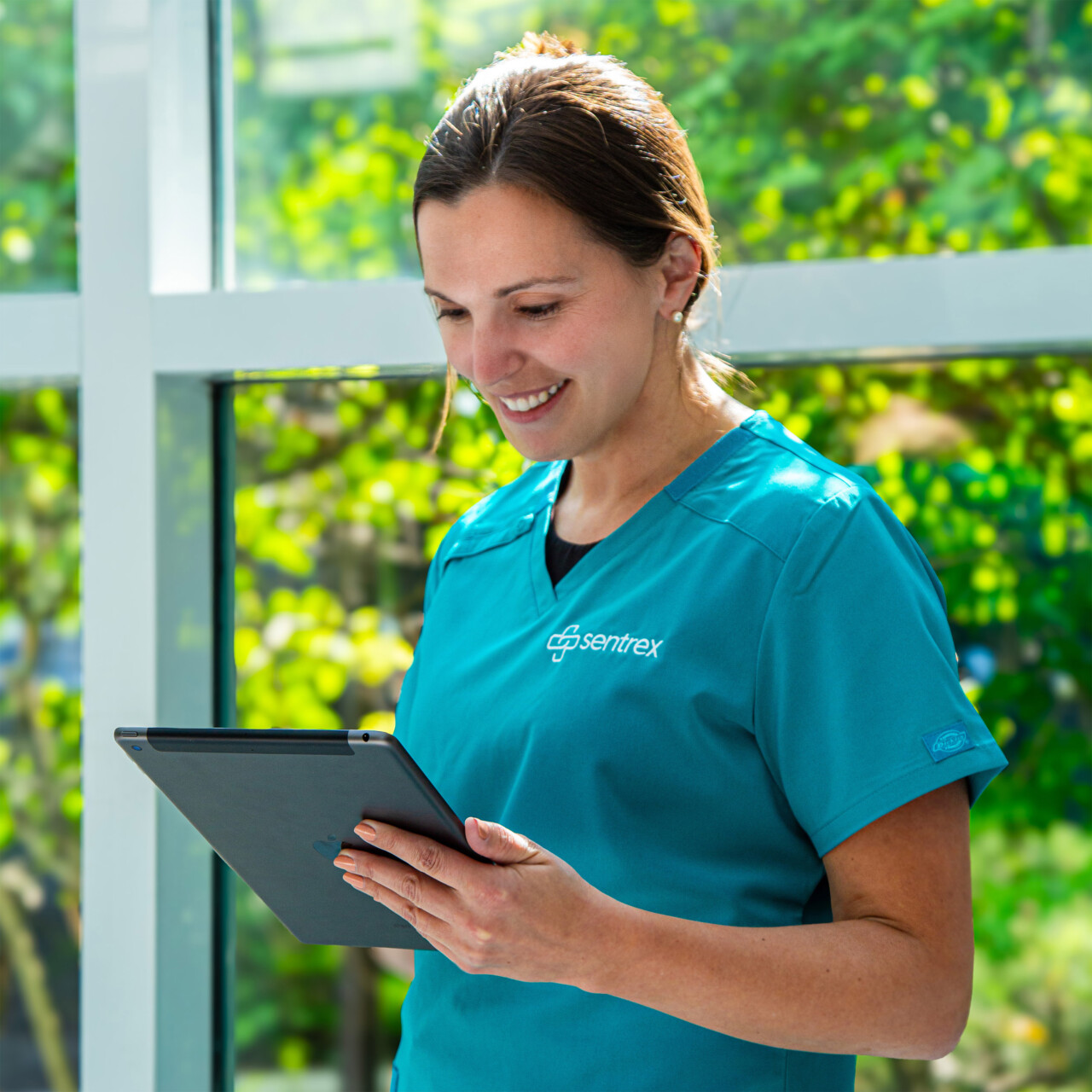 Healthcare worker using a tablet
