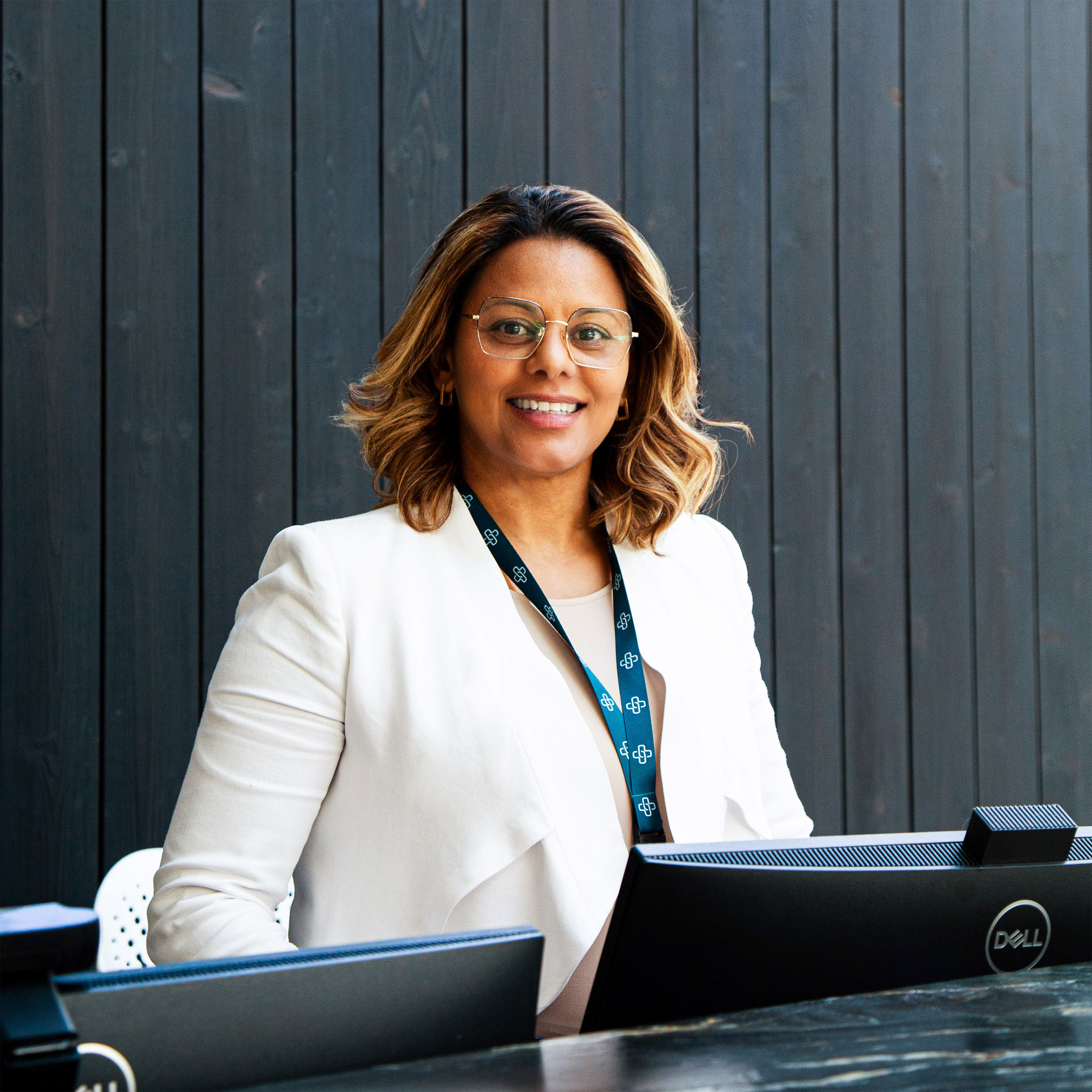Smiling reception team member at the front desk