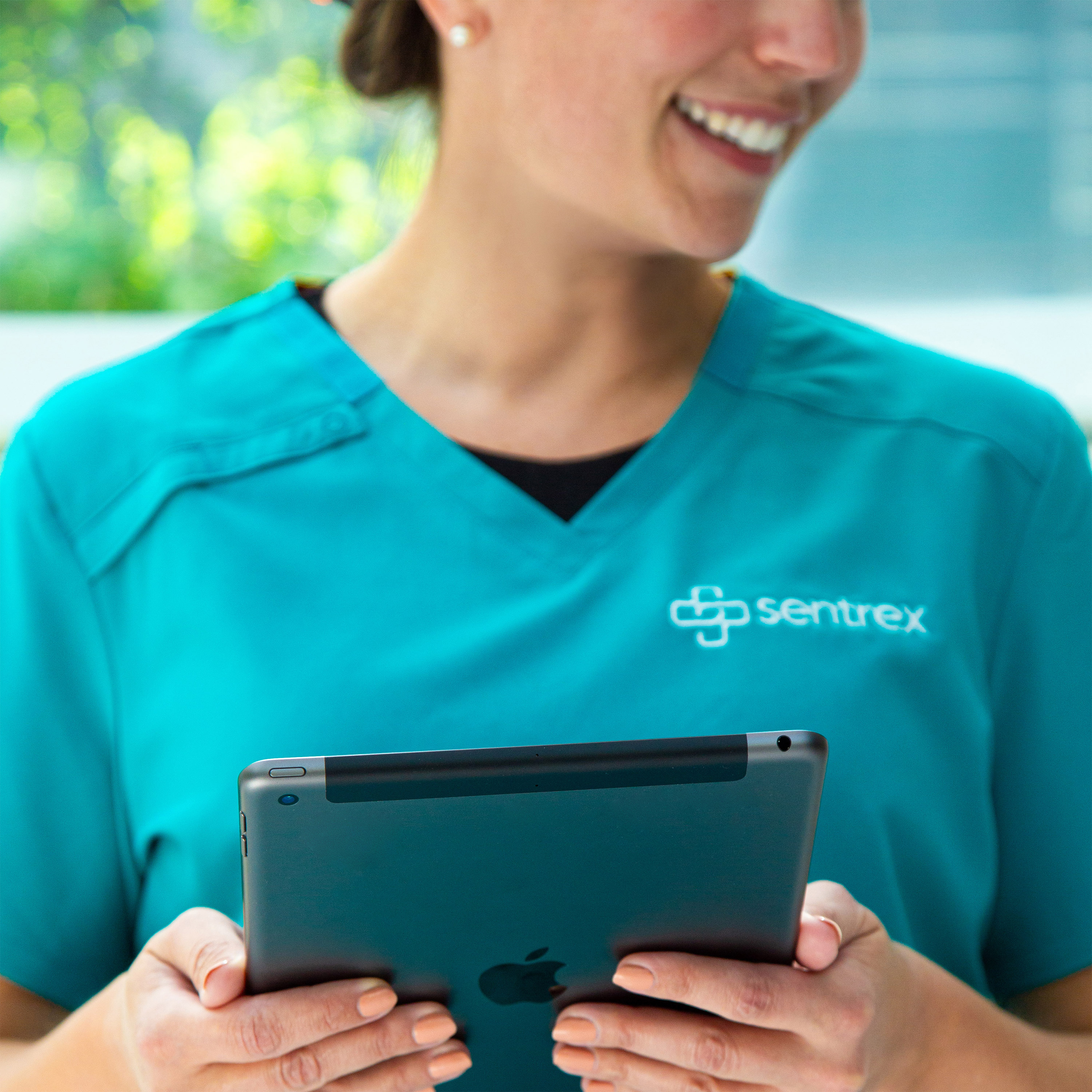 Healthcare professional reviewing patient care information