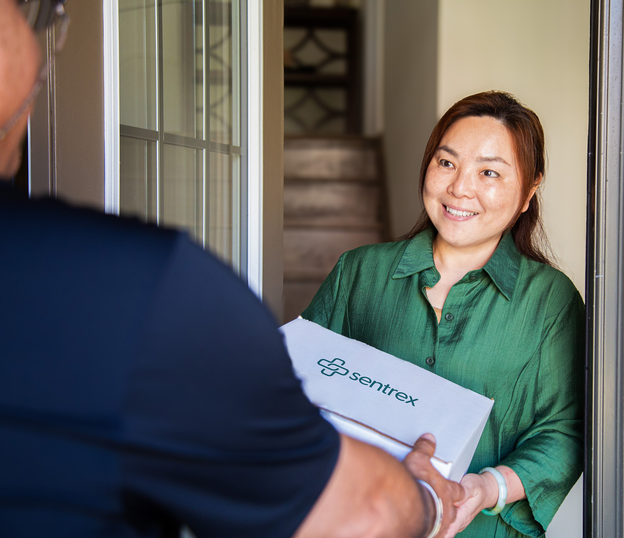 Sentrex team member delivering medication to a patient