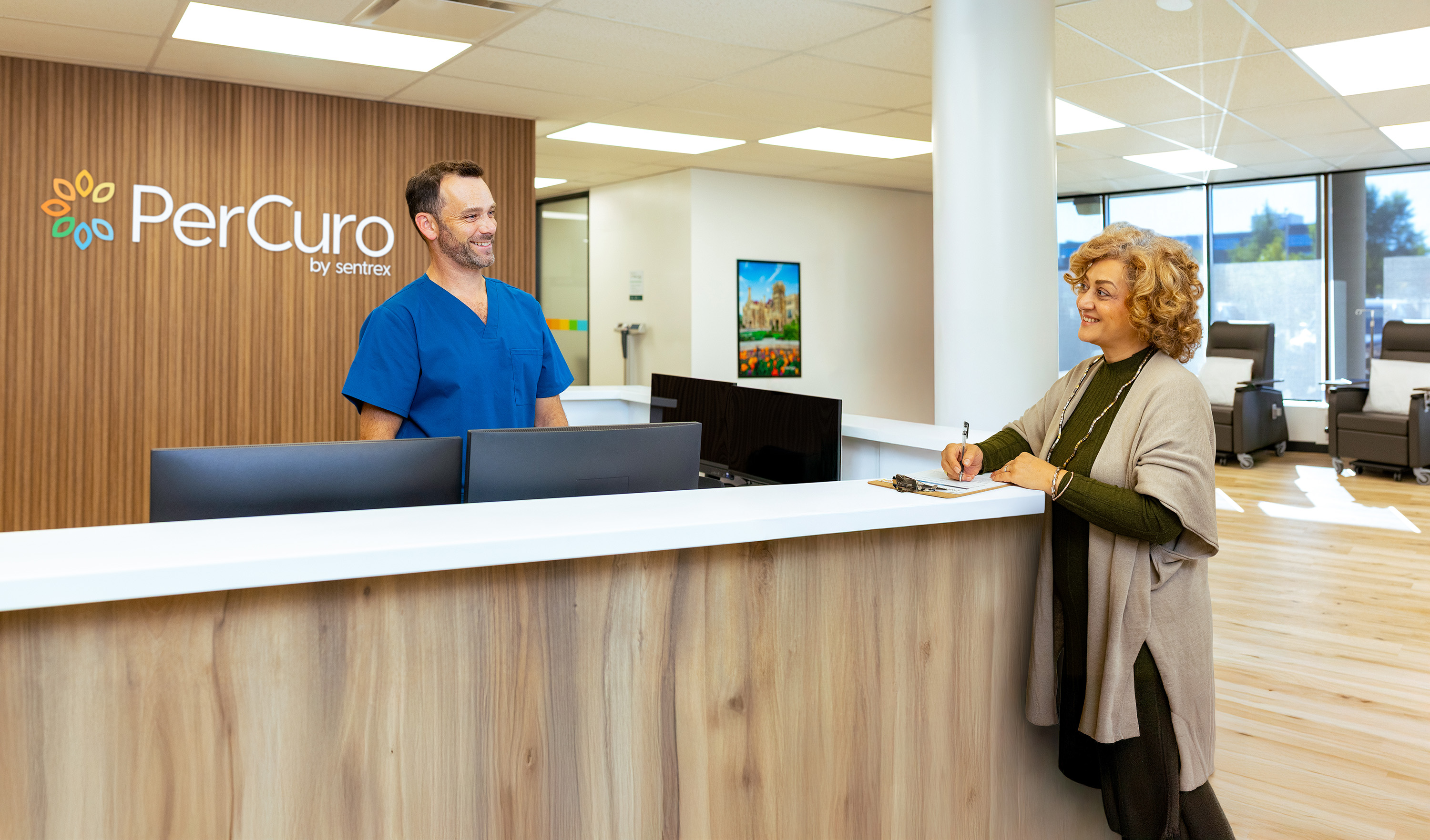 PerCuro nurse with a patient at the clinic